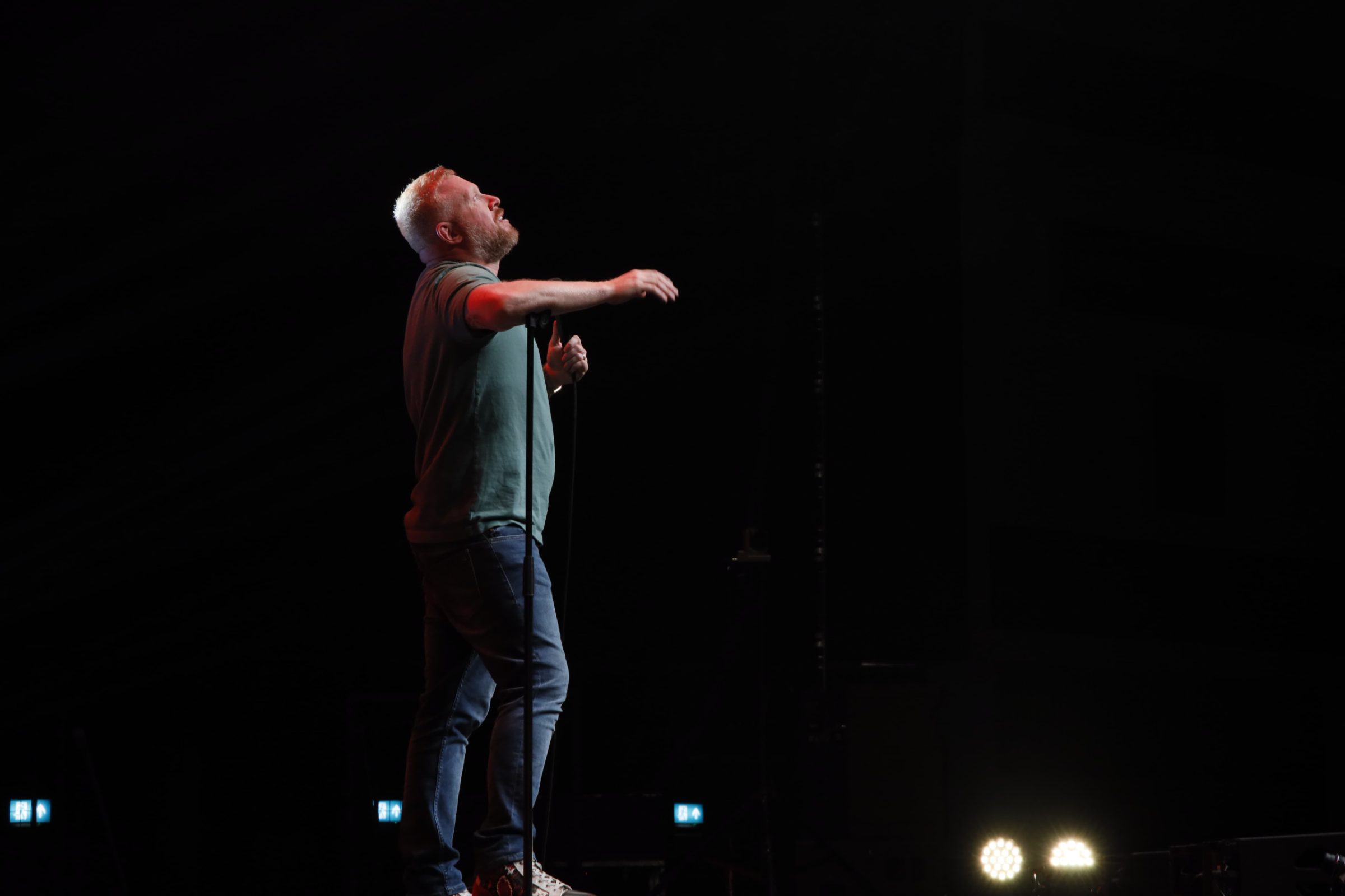 Paul Smith on stage under a single spot during the HAPPY Tour 2024/25