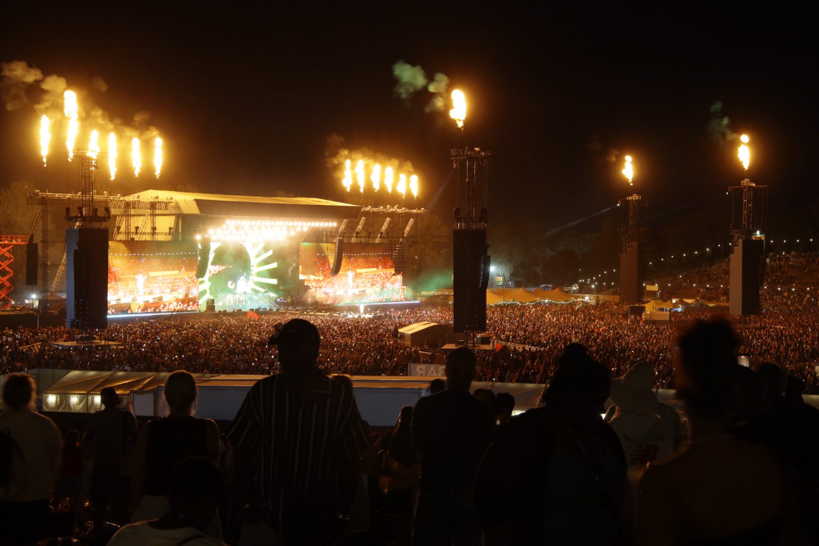 Wide view of Reggae Land at the National Bowl with the stage and video walls lit