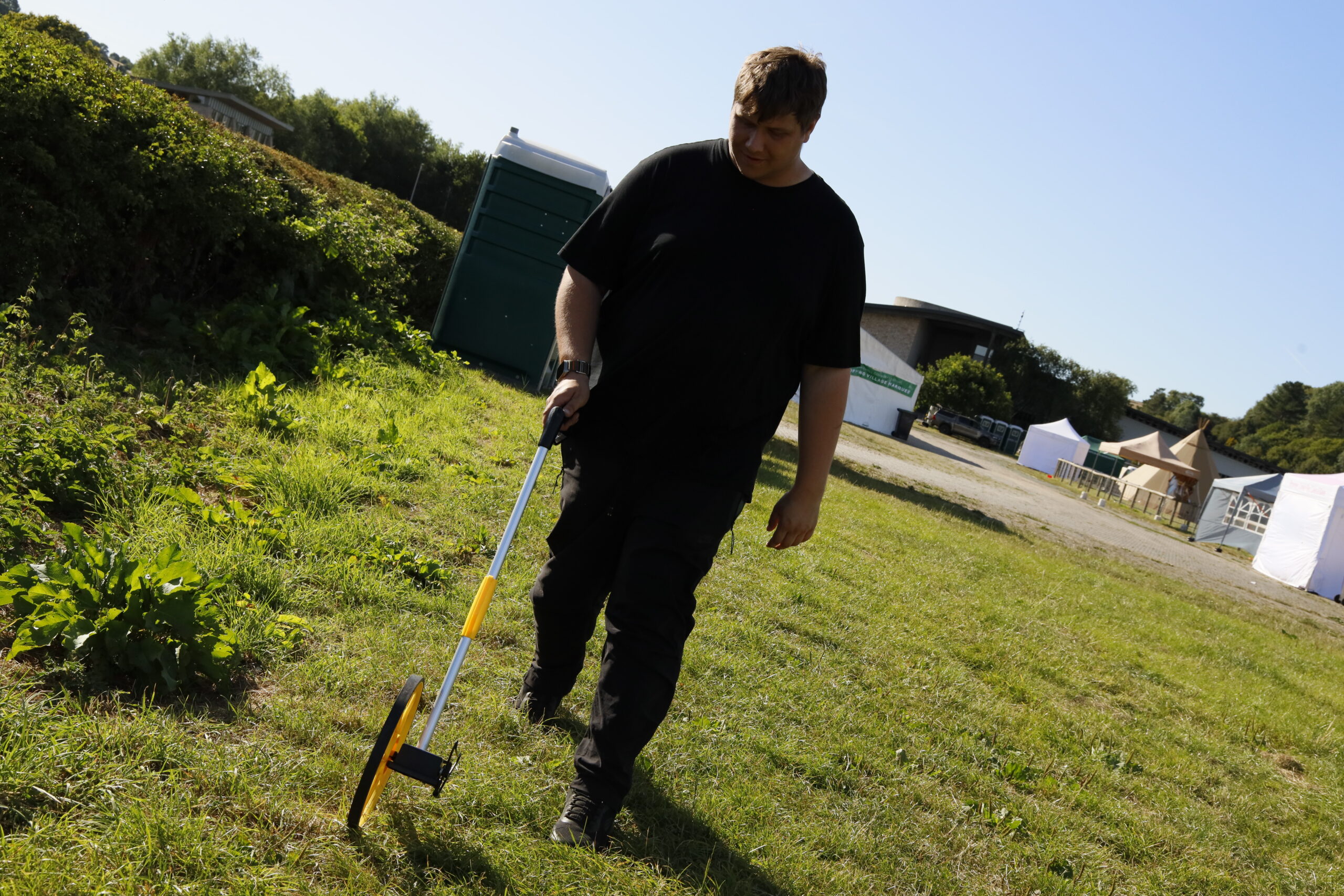 Site survey being carried out with a measuring stick