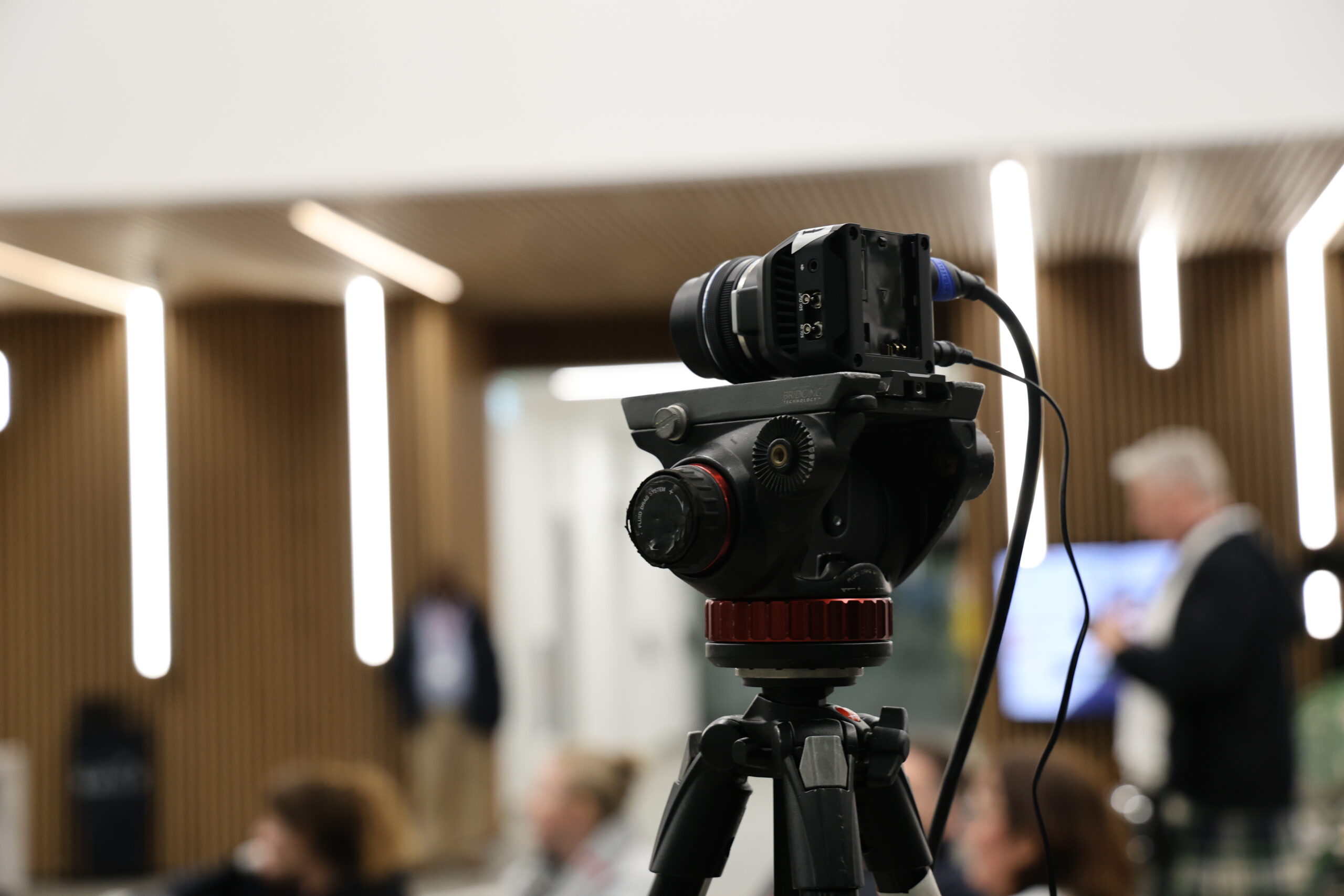 Speaker on stage covered by dwmedia cameras